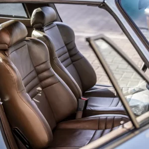 Brown leather front seats inside a classic car